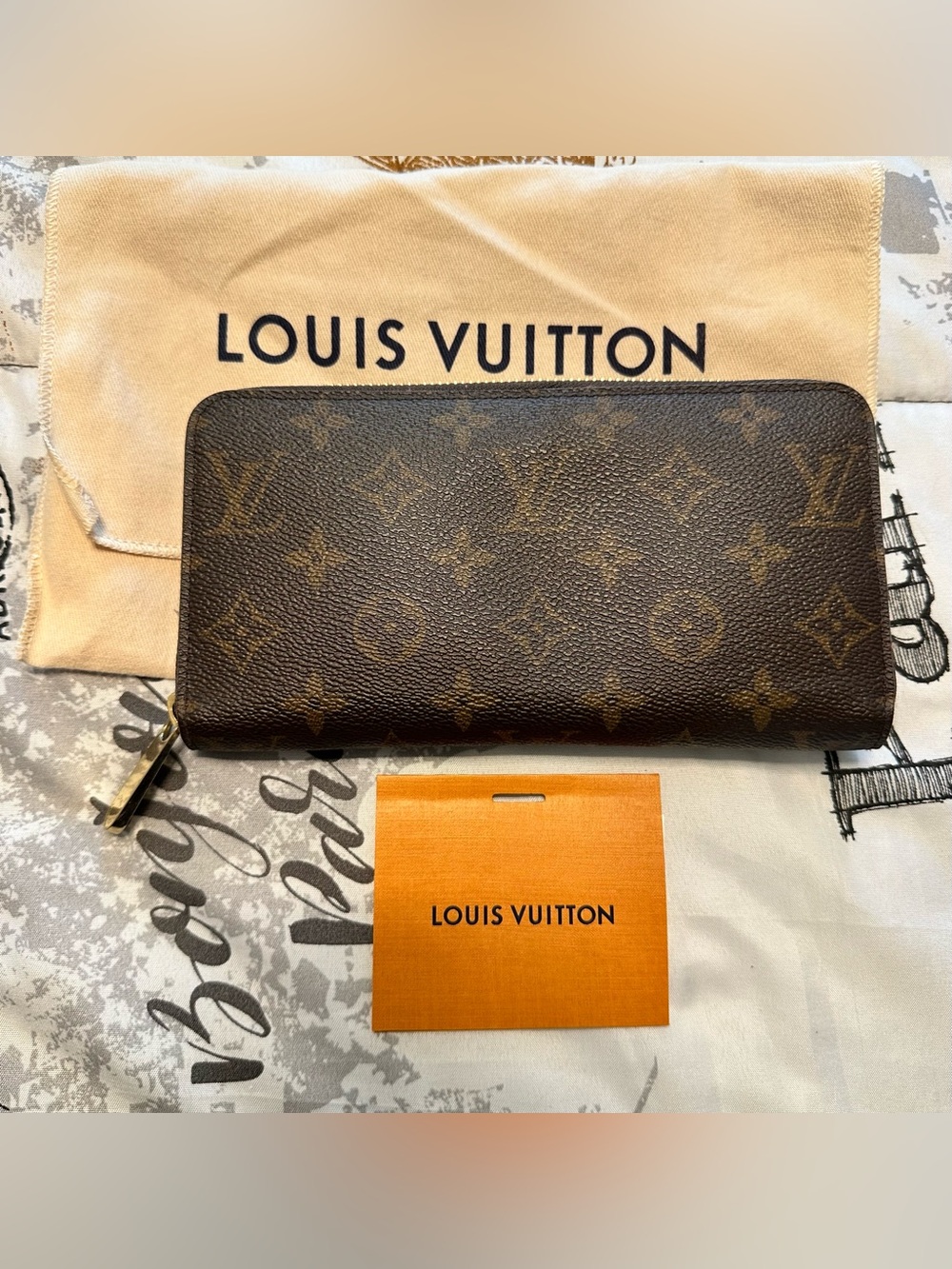 Louis Vuitton Brown Monogram Zip Wallet with Gold Hardware